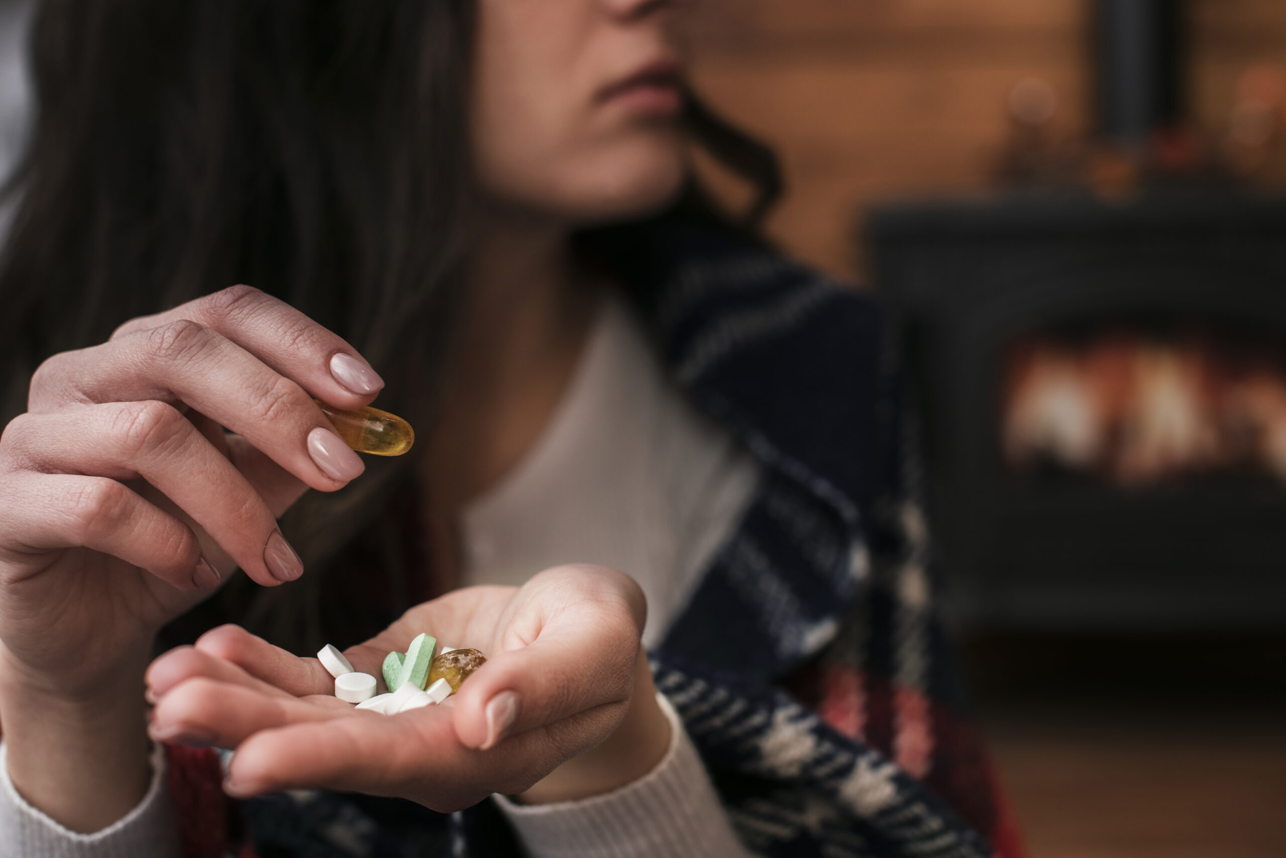 close-up-woman-holding-medicine-her-hand